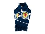 A blue and white knitted scarf with a Scottish crest and the word 'SCOTLAND' on it.