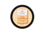 Orange seaweed pearls, a vegan alternative to caviar, in a Japanese style container.