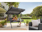 Mother and child on a garden swing, with a garden lounge chair nearby.