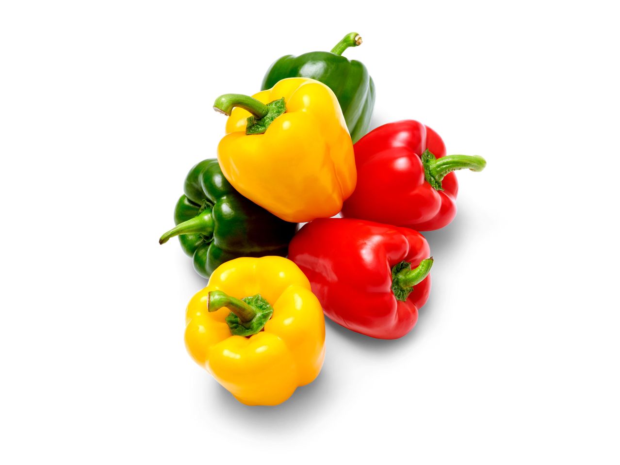 Verse gele, rode en groene paprika's.