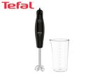 Black immersion blender with a measuring cup on a white background.