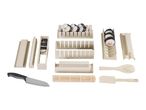 Sushi making kit with molds, bamboo mat, knife, and finished sushi rolls.