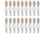 A grid of white clothes pegs with beige non-slip pads on a black background.