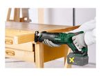 A person using a cordless reciprocating saw to cut a piece of wood on a workbench.