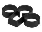 Black plastic napkin rings, shaped like the number 8, on a white background.