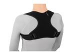 Rear view of a person wearing a black posture corrector over a light grey long-sleeved shirt.