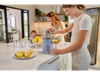 Citrus juicer and lemons in a modern kitchen.