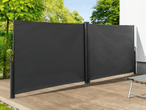 Moderne, anthrazitfarbene Sichtschutzelemente aus Aluminium für den Garten.