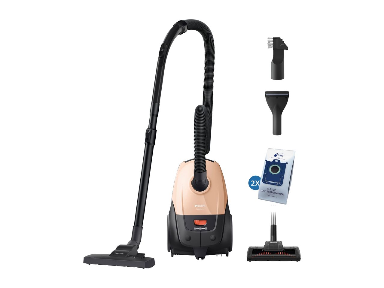 Vacuum cleaner with hose, attachments, and two replacement dust bags.