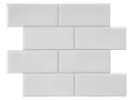 LIVARNO home self-adhesive white subway wall tiles arranged in a brick pattern.