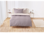 A mauve and cream patterned duvet cover set on a bed.