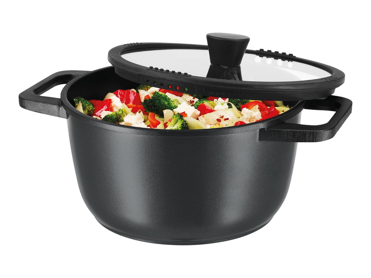 A black, round pot with a glass lid, filled with cooked vegetables.