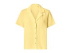 Yellow short-sleeved button-up shirt with a collar, made from a textured fabric.