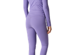 Woman from behind in a long-sleeved top and purple leggings.