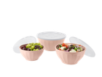 Three pink bowls with white lids, two filled with fruit and salad.