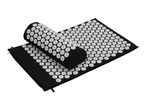 Black acupressure mat and pillow with white plastic spikes