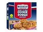 Ready-to-bake cranberry cookie dough box with baked cookies and oven instructions.