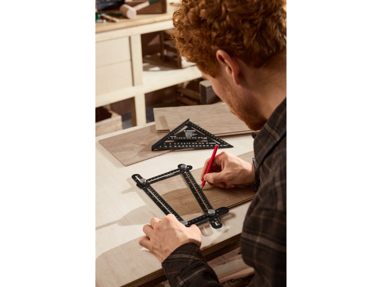 Man using a drilling template and angle ruler on wood.