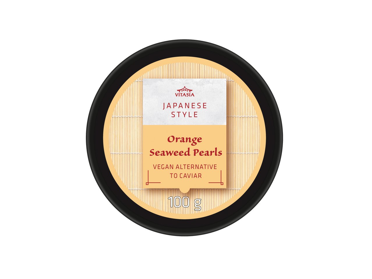 Orange seaweed pearls, a vegan alternative to caviar, in a Japanese style container.