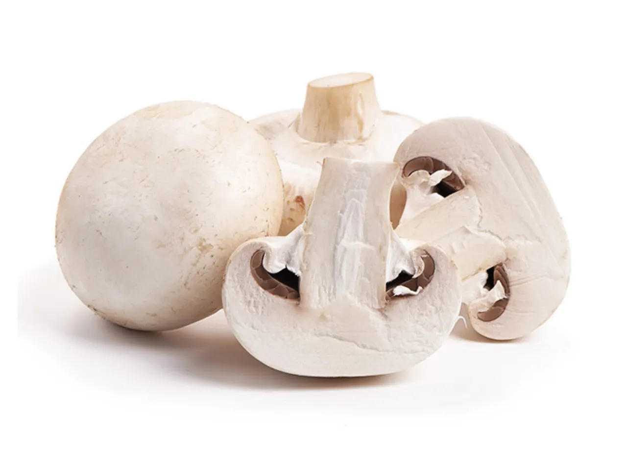 Whole and sliced button mushrooms.