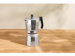 Espressor SILVERCREST pe o masă de lemn, umplut cu cafea măcinată.