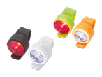 Vier bunte Fahrradlichter in Schwarz, Weiß, Grün und Orange.