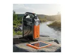 Portable power station with solar panel on a rock by a river, featuring USB, TF, and 5V IN/OUT ports.