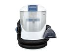 Compact carpet and upholstery cleaner with hose and nozzle attachment