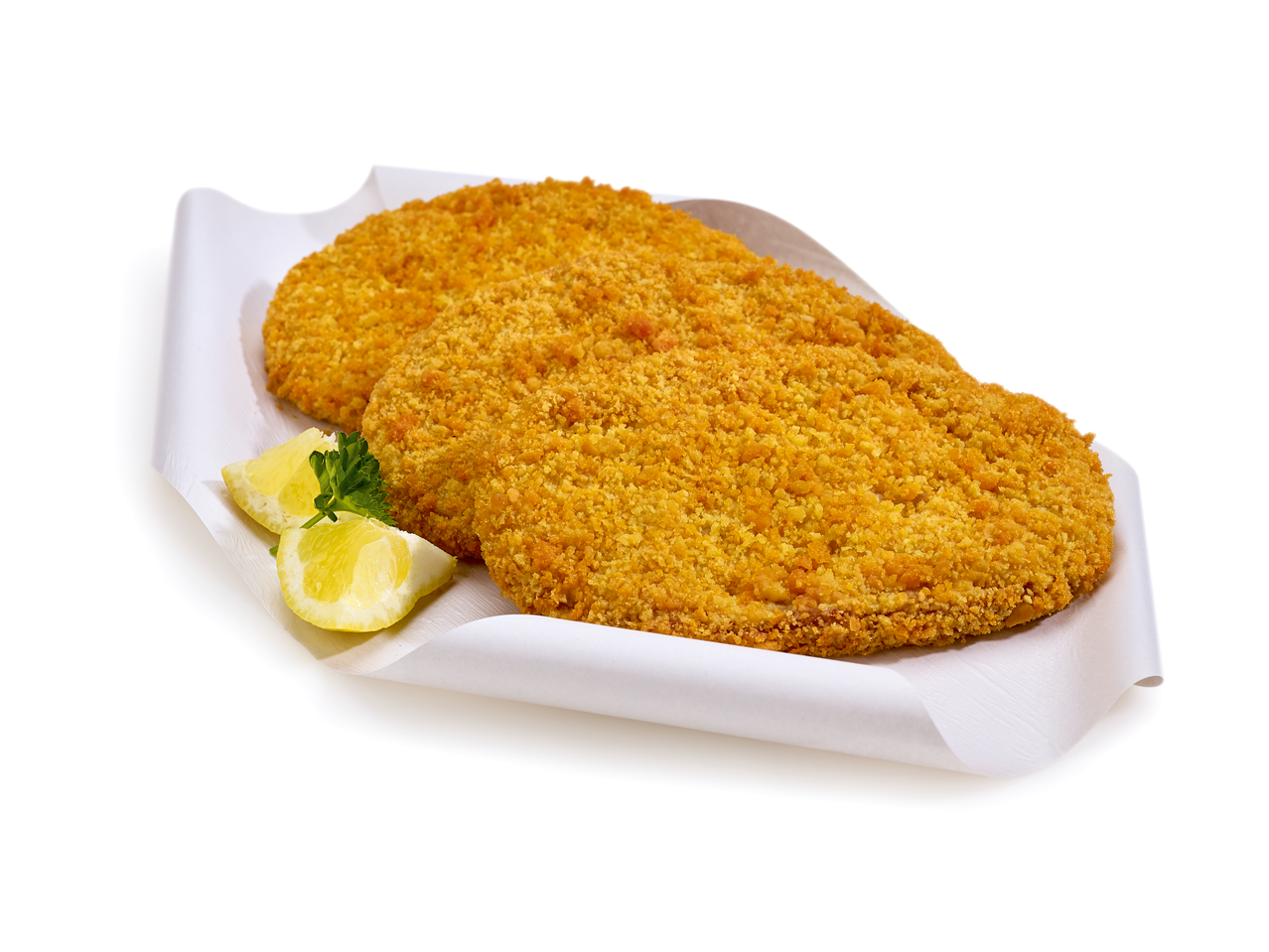 Deux escalopes de dinde panées avec des quartiers de citron et du persil sur du papier blanc.