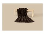 A dark brown faux fur blanket draped over a light wooden woven bench.