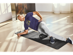 Man using a fitness mat and foam roller.