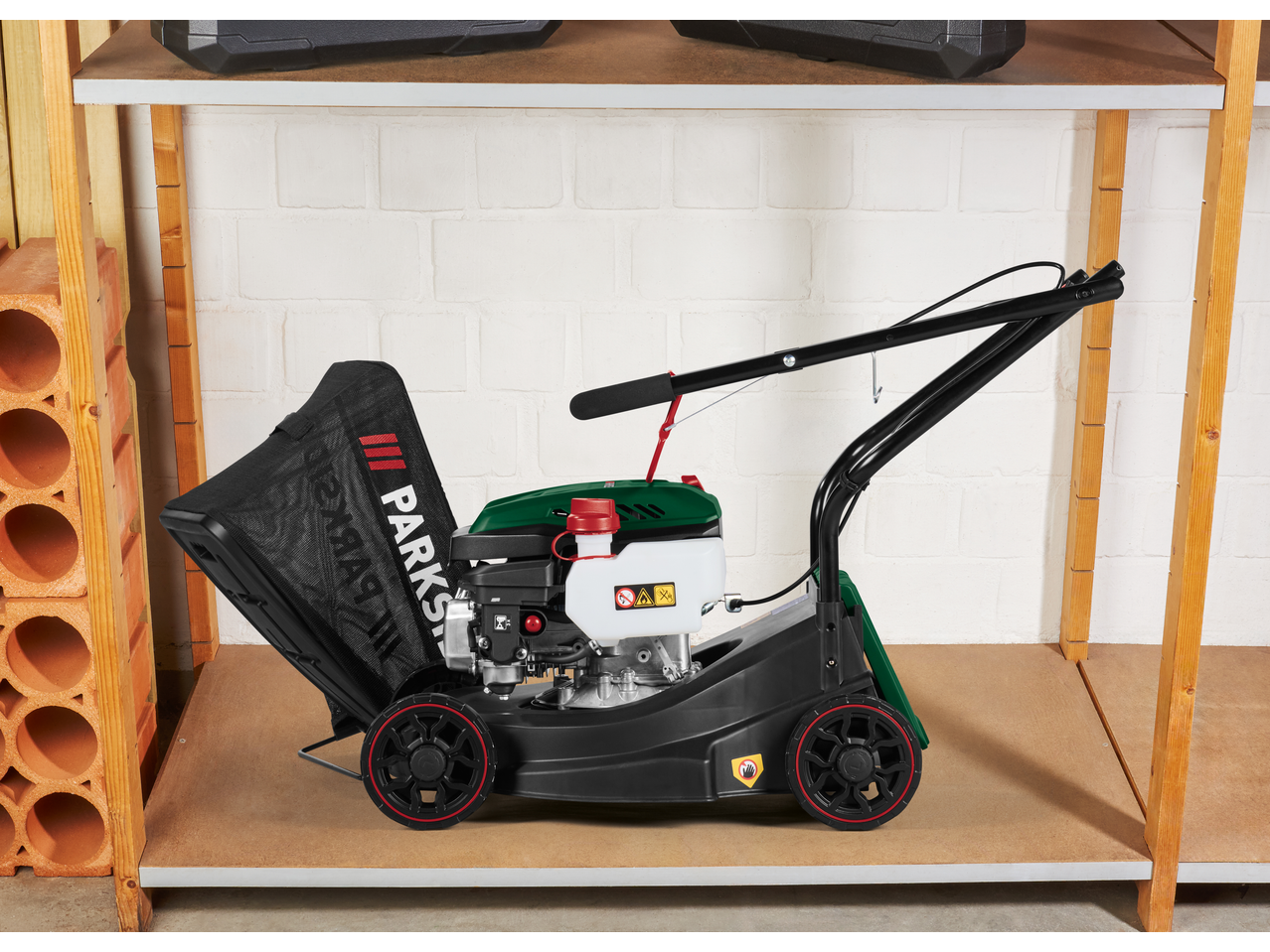 PARKSIDE PBRM 39 E4 petrol lawnmower with grass collector on a shelf