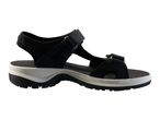 Black and white women's sports sandal with adjustable straps and a thick sole.