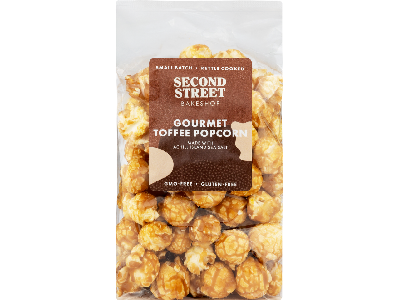 A clear bag of Second Street Bakeshop Gourmet Toffee Popcorn with a brown label.