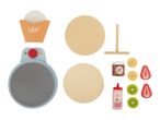 Toy crepe maker set with crepes, fruit toppings, chocolate spread, and strawberry sauce.