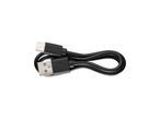 Черен USB-C кабел за зареждане, включен към 3 в 1 акумулаторна лампа Parkside®.

