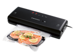 SILVERCREST® Vacuum Sealer with salmon fillets in a vacuum bag