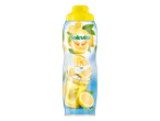 Bouteille de sirop de citron Solevita avec des citrons et un verre de limonade.