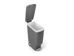 A gray Simplehuman slim step can with a white inner bucket.