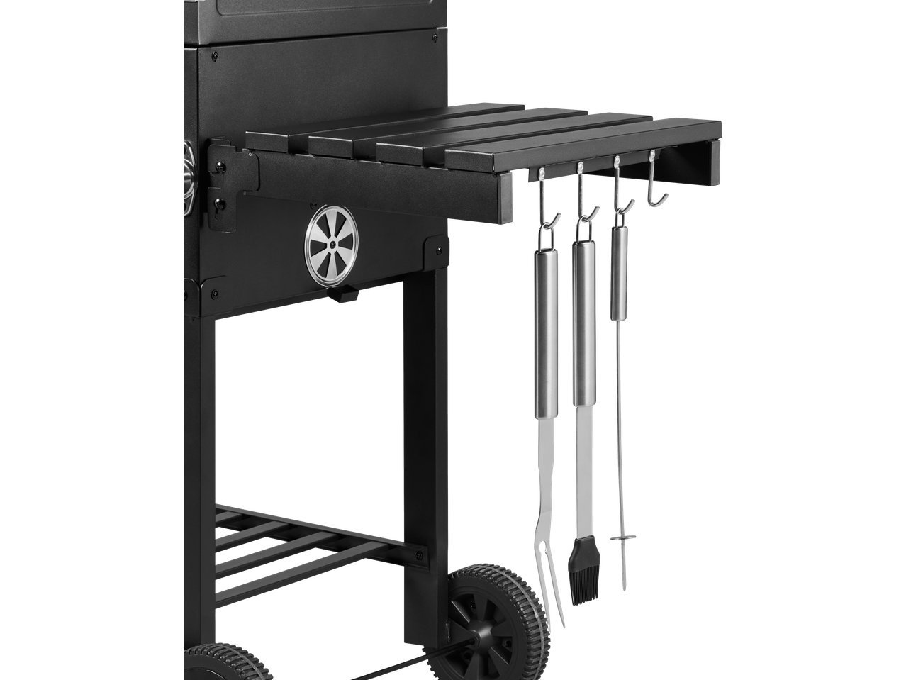 Grillmeister Charcoal Barbecue with side shelf and hanging barbecue tools.