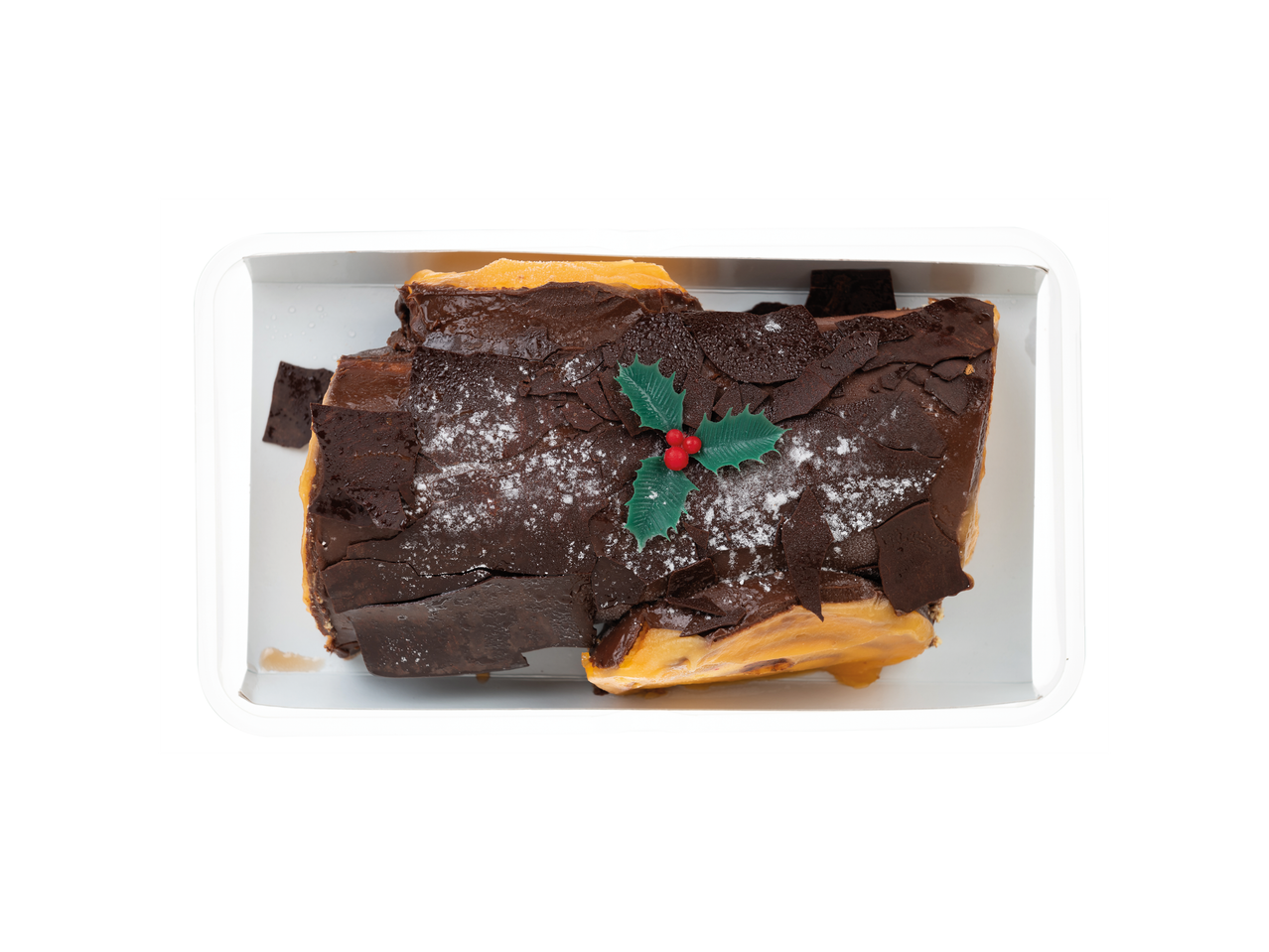 Deluxe Tronco de Natal, um tronco de Natal de chocolate com decoração de azevinho numa bandeja branca.