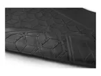 Close-up of textured black fabric, possibly upholstery or a similar material.