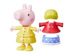 Peppa Pig toy figure in a yellow raincoat with additional red coat and blue skirt.