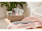 Foot files, brush, and pumice stone in a wicker basket.