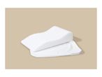 White foam pillow with a ribbed surface and a white pillowcase.