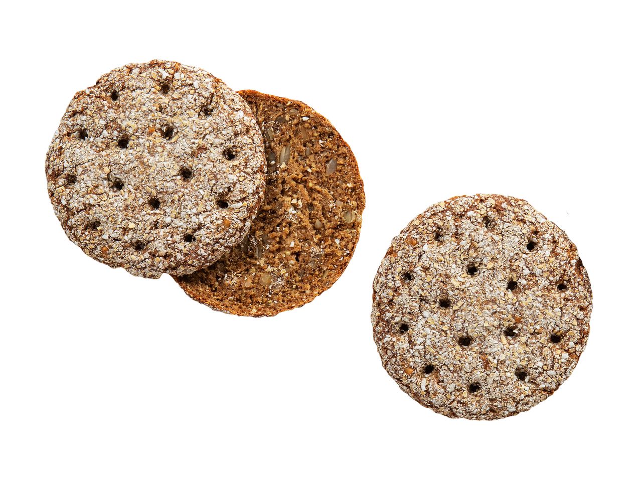 Kaksi pyöreää, tummaa näkkileipää, joista toinen on halkaistu ja paljastaa siemeniä.