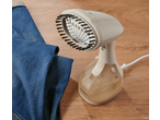 SILVERCREST® Garment Steamer with brush attachment next to blue jeans on a wooden surface.