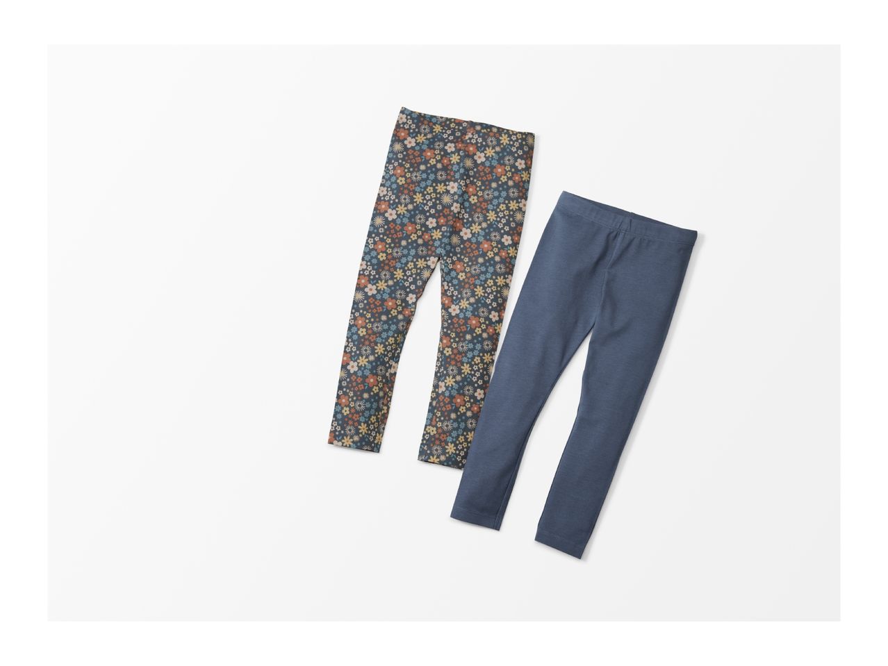 Two pairs of children's leggings, one with a floral pattern and one solid blue.