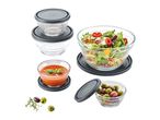 A set of Anchor Hocking glass bowls with lids, ideal for food storage and serving.