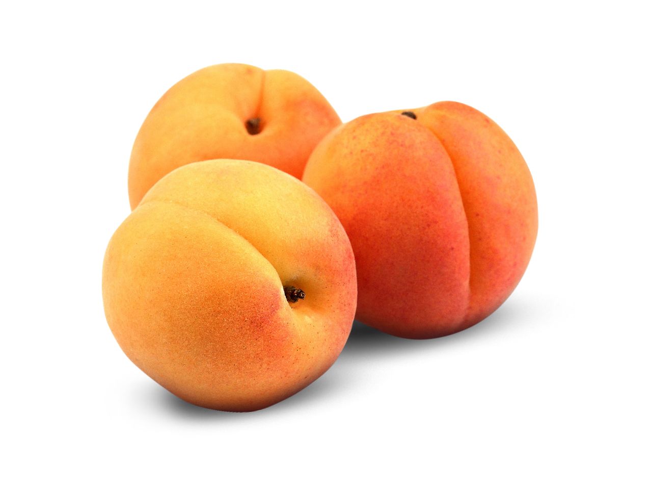 Three ripe apricots.